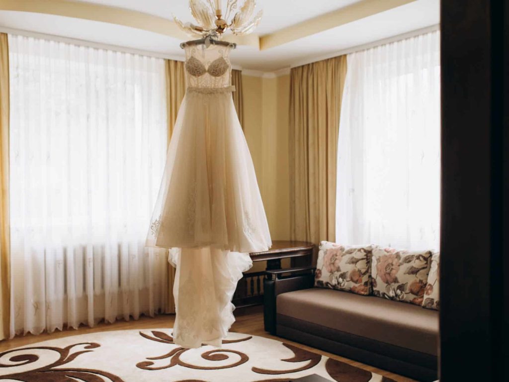 bride-s-dress-hangs-chandelier