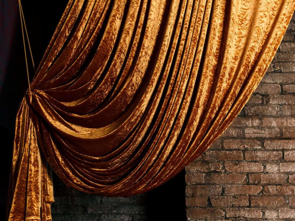 golden-big-curtain-brick-wall-background